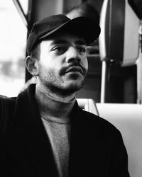 Close-up of young man wearing cap