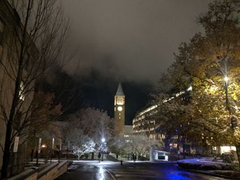 Illuminated street in front of jennie mcgraw tower on the cornell university campus