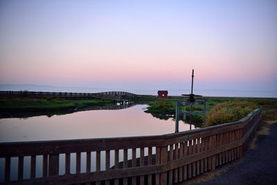 Scenic view of sea against clear sky during sunset