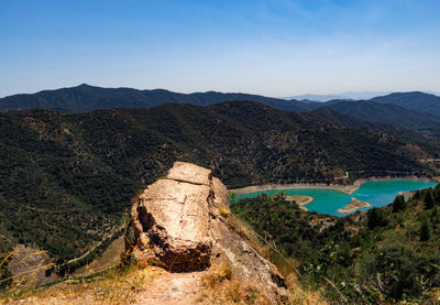 High angle view of river with mountain range in background