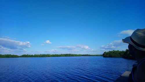 Scenic view of sea against blue sky