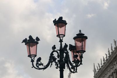 Low angle view of street light against sky