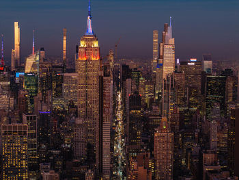Illuminated buildings in city at night