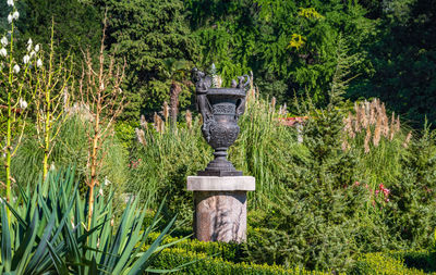 Close-up of statue against trees