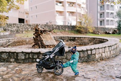 Rear view of man riding bicycle