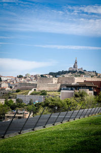 Distant view of marseille cathedral against sky