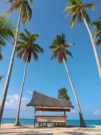 Built structure on beach against sky