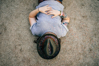 High angle view of woman lying on beach