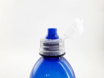 Close-up of blue water bottle against white background