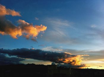 Scenic view of dramatic sky at sunset