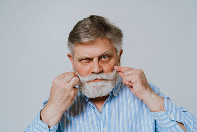 Portrait of man against white background