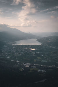 High angle view of townscape by sea against sky