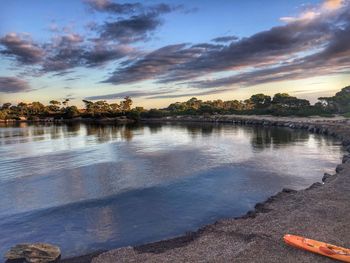 Scenic view of lake against sky during sunset