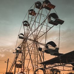 Low angle view of ferris wheel against sky