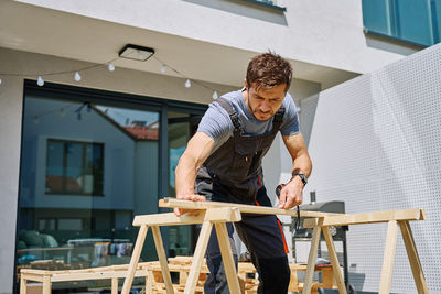 Side view of man working at gym