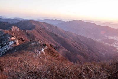 Scenic view of mountains against sky during sunset