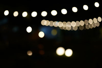 Defocused image of illuminated lights at night