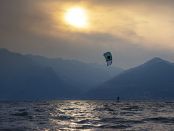 Kitesurfing scene at sunset on lake como