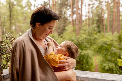 Happy grandmother and grandson enjoy time together. positive middle age woman