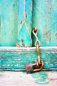 Close-up of padlock on wood