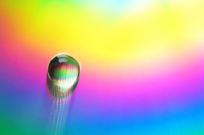 Close-up of water drop on glass