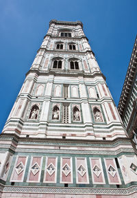 Low angle view of building against blue sky