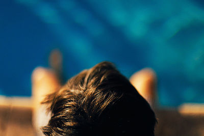 Close-up of person at poolside