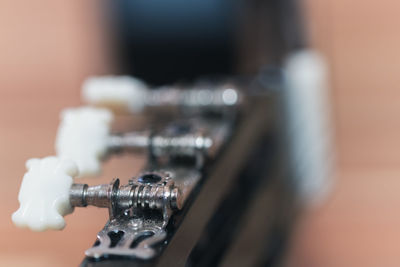 Close-up of guitar on table