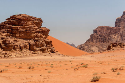 Rock formations in desert against clear sky