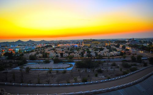 High angle view of townscape against sky at sunset