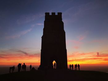 Silhouette of people at sunset