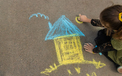 High angle view of girl standing on road