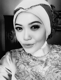 Portrait of smiling woman at home