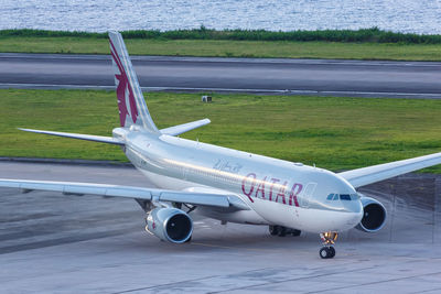 High angle view of airplane on airport runway