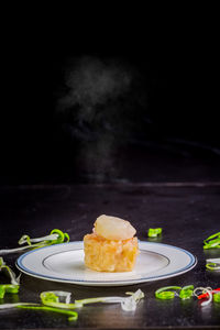 Close-up of cake served in plate on table