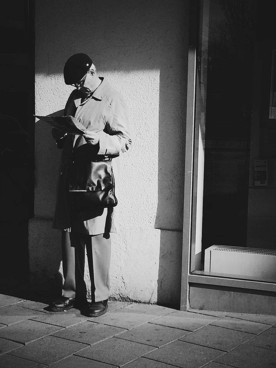 architecture, built structure, building exterior, street, men, sunlight, shadow, day, lifestyles, bicycle, wall - building feature, full length, house, wall, rear view, outdoors, sidewalk, city