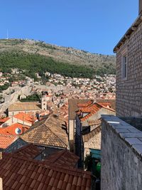 High angle view of townscape against clear blue sky