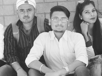 Portrait of friends sitting outdoors