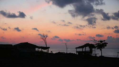 Silhouette of pier at sunset