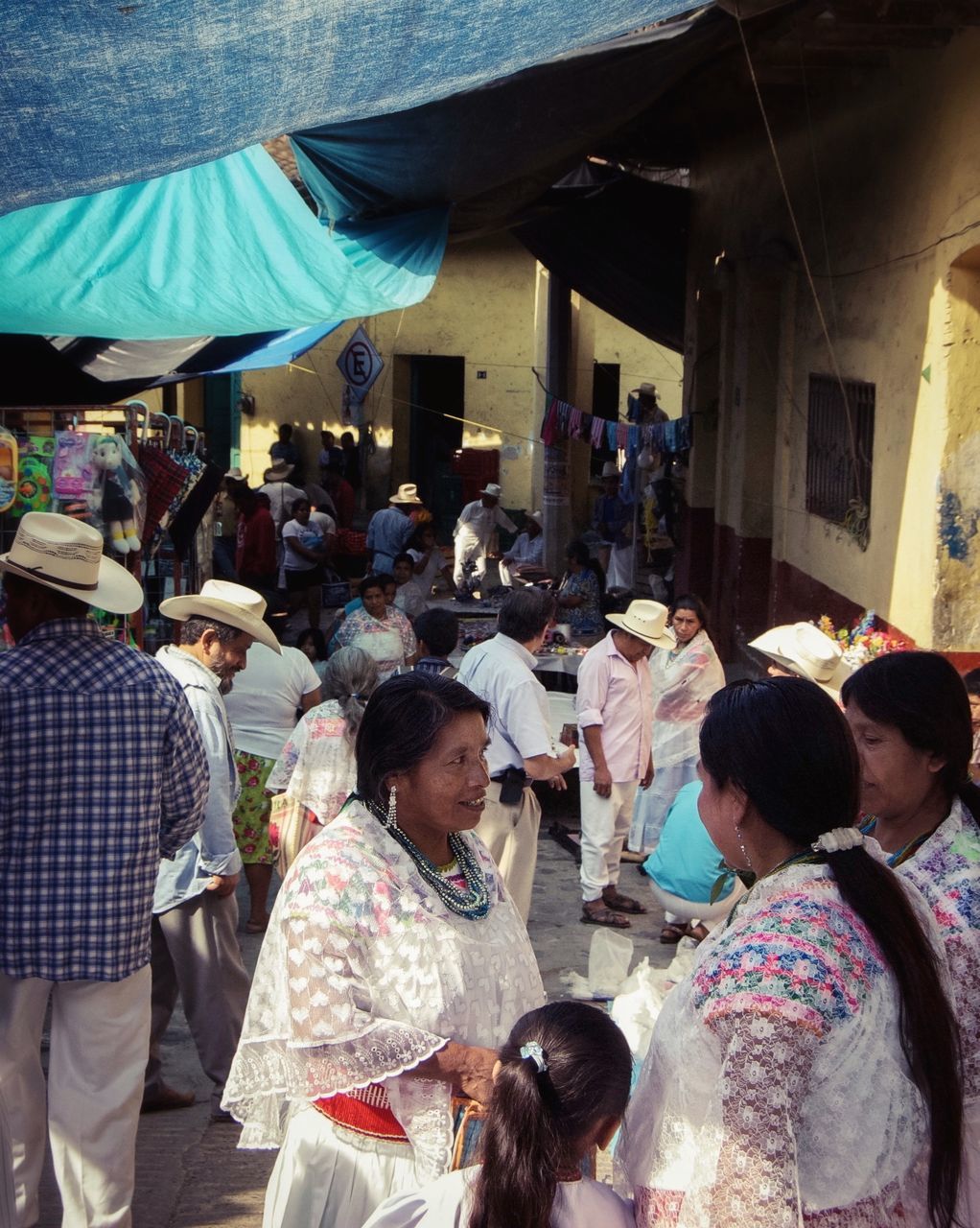 lifestyles, men, person, leisure activity, large group of people, togetherness, sitting, casual clothing, crowd, standing, rear view, market, indoors, medium group of people, high angle view, day, street