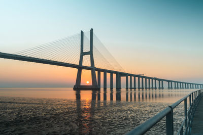 View of suspension bridge at sunset