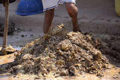 Low section of man working in water