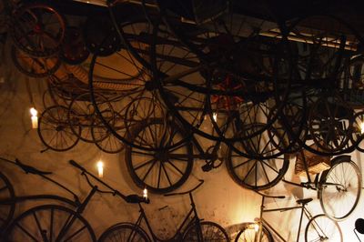 Low angle view of illuminated electric lamp against sky