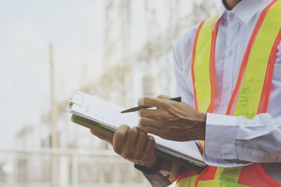 Low angle view of man working on paper