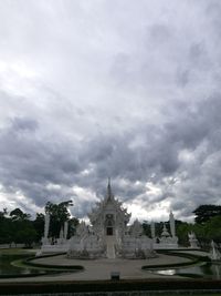 Statue of cathedral against cloudy sky