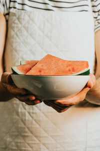 Midsection of woman holding food