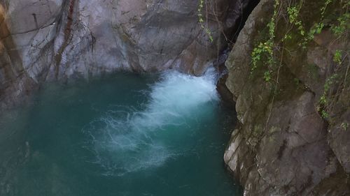 Stream flowing through cliff