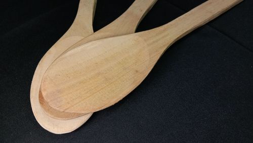 High angle view of leaf on table against black background