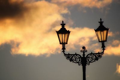 Low angle view of street light against sky