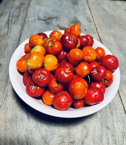 High angle view of strawberries in bowl on table